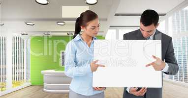 Business people holding blank card in office