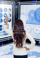 Businesswoman touching and interacting with technology interface panels
