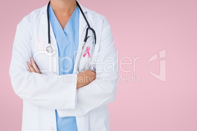 Doctor woman with breast cancer awareness ribbon