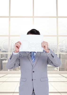 Business man holding blank card in office