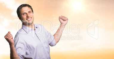 Man celebrating success in sunset