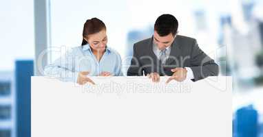 Business people holding blank card in office