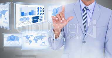 Businessman touching and interacting with technology interface panels