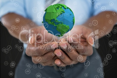 Business man holding a globe with connectors