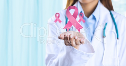 Doctor woman with breast cancer awareness ribbons