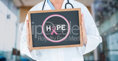 Doctor holding a blackboard with a breast cancer awareness ribbon