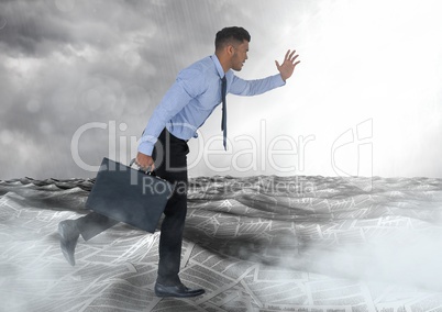 Businessman running with briefcase in sea of documents under sky clouds