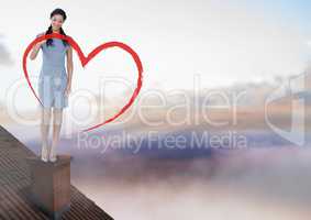 Heart drawing and Businesswoman standing on Roof with chimney and colorful sky