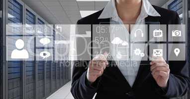 Business woman holding a glass and graphics in server room