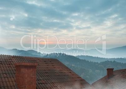 Roofs with chimney and misty landscape