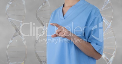 Doctor pointing something with 3D DNA strands against grey background