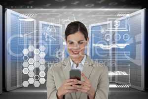 Business woman holding a phone and graphics in server room