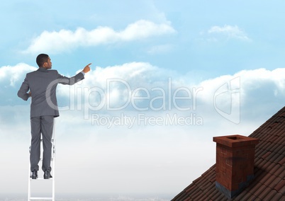 Businessman standing on ladder near roof