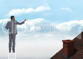 Businessman standing on ladder near roof