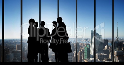 Business people silhouettes against building