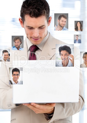 Man holding laptop with Profile portraits of people contacts