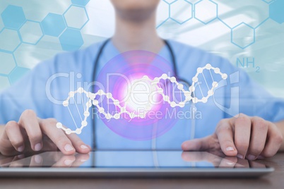 Doctor woman using a tablet with DNA strand and flares