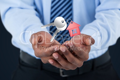 Business man holding keys