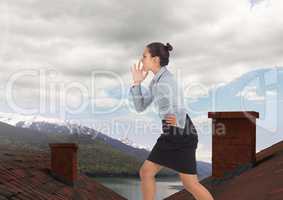 Businesswoman standing on Roofs with chimney and mountain lake landscape