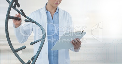 Doctor woman interacting with 3D DNA strand