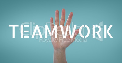 Hand interacting with teamwork business text against blue background