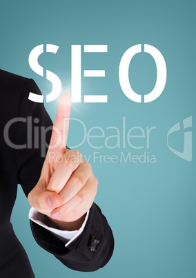 Hand interacting with SEO business text against blue background