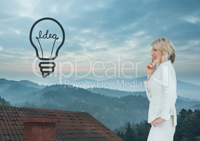 Light bulb icon and Businesswoman standing on Roof with chimney and misty landscape