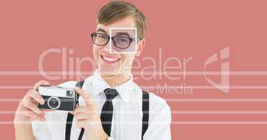 man holding camera with eye focus box detail over glasses and lines