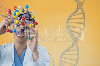 Doctor woman holding a medical figure with 3D DNA strand against yellow background