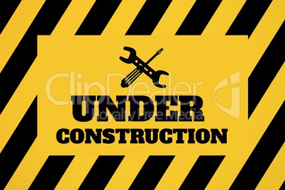 Under construction text with tools graphics against yellow and black background