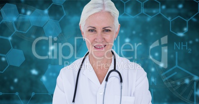 Doctor woman standing against blue background with medical interfaces