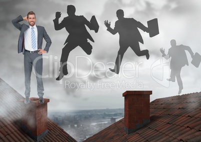 Businessman standing on Roofs and businessmen silhouettes jumping with chimney and cloudy city
