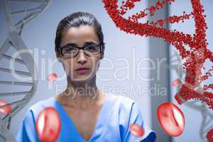 Worried doctor woman standing with 3D DNA strand and cells