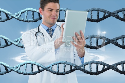 Happy doctor man using a tablet with 3D DNA strands