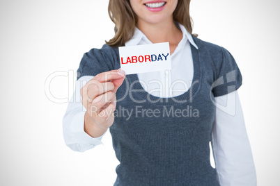 Composite image of smiling woman showing card