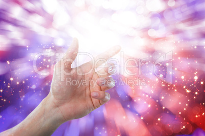 Composite image of hand of man pretending to touch an invisible screen