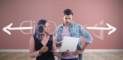 Composite image of business colleagues using laptop