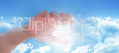 Composite image of hand of man pretending to hold an invisible object