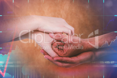 Composite image of cropped hands holding together