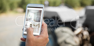 Composite image of interior of kitchen and bedroom on mobile screen