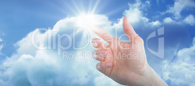 Composite image of hand of man pretending to touch an invisible screen