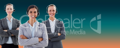 Composite image of business team wearing headsets and standing arms crossed