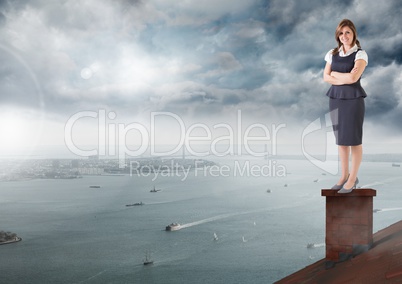 Businesswoman standing on Roof with chimney and cloudy city port