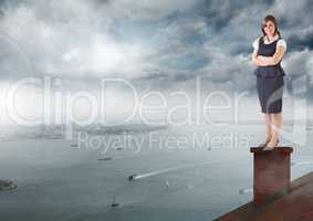 Businesswoman standing on Roof with chimney and cloudy city port