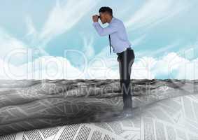 Businessman in sea of documents under sky clouds with binoculars