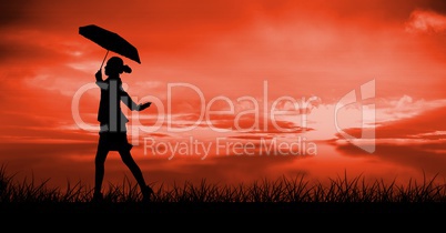 Business woman walking silhouette against sunset or sunrise