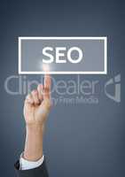 Hand interacting with SEO business text against blue background