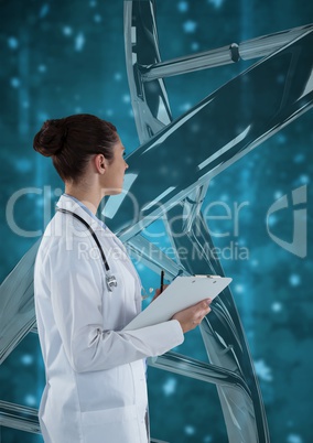 Doctor woman standing with 3D DNA strand against blue background