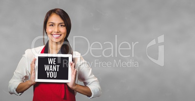 Business woman holding a tablet with we want you text