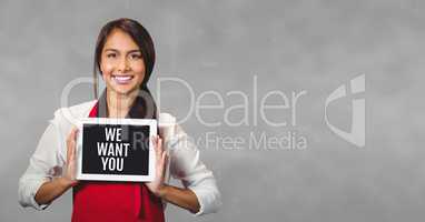 Business woman holding a tablet with we want you text